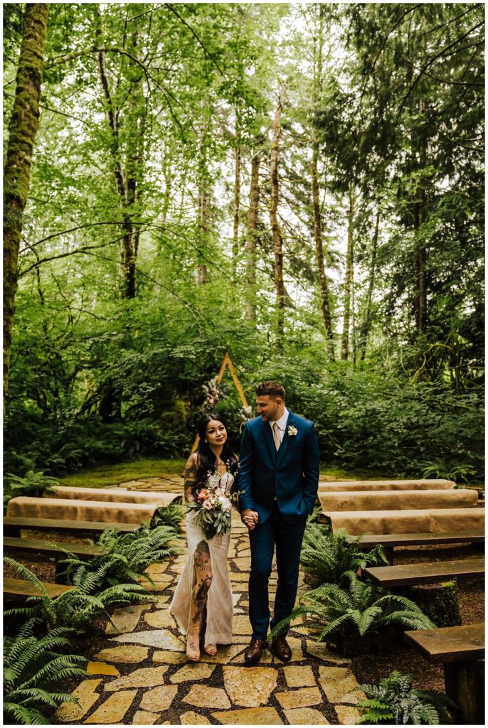 Newlyweds in forest ceremony space