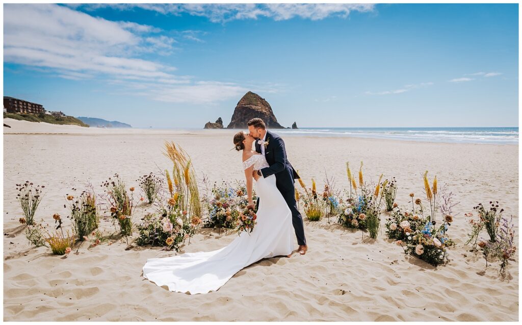 Newlyweds kissing at their ceremony space during their Surfsand Resort Cannon Beach Micro Wedding on the Oregon Coast